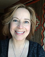 Portrait image of Sissel Schroeder wearing a grey shirt