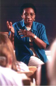 Image of Nellie Y. McKay lecturing before a class wearing a blue shirt