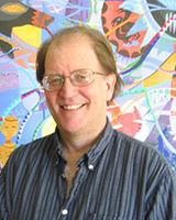 Portrait image of Craig Werner wearing glasses and a striped shirt standing in front of a colorful and bright painting