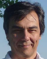 Portrait image of Mario Ortiz-Robles (closely cropped) outdoors