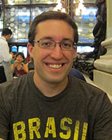 Portrait image of Matthew Rarey wearing glasses and a T-Shirt with the word "Brasil" on it