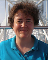 Portrait image of Irina Shevelenko outdoors wearing a blue shirt