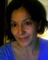 Closely-cropped portrait image of Mary Beltrán wearing a bright blue shirt