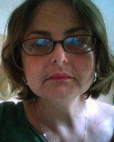 Closely-cropped portrait image of Florence Bernault wearing glasses