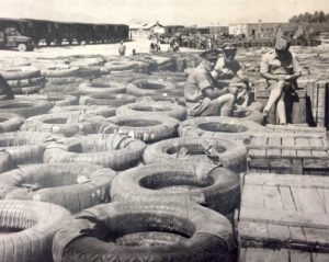 Image of the Chinese Supply Depot, Zahedan, Iran in 1943 depicting piles of tires and boxes far into the distance