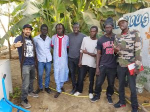 Professor D and members of Grand Yoff’s Activist Mob visit G-HipHop’s new community gardening project.