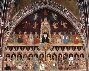 Image of a fresco from a Catholic chapel depicting religious figures in multi-colored robes. The composition is schematic and joins a wealth of personifications and historical exempla in a serial and symmetric arrangement. In the middle of the upper section, St Thomas Aquinas, seated on a throne wearing a black robe and surrounded by an aureole, presents an open book to the viewer. Floating above the saint's throne are the four winged cardinal virtues and the three theological virtues. Seated to the left of Thomas, from the viewer's standpoint, are Job, David, Paul, Mark, and John the Evangelist; to the right, Solomon, Isaiah, Moses, Luke, and Matthew. Crouching at the feet of the saint, their bearing and gestures expressing resignation, are the heretics, Sabellius, Averroës, and Arius. In the lower register a uniform row of fourteen thrones extends like a line of choir stalls across the wall. Seated on the thrones on the right side are female personifications of the liberal arts, their antique and biblical representatives at their feet.