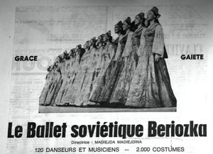 In this black and white picture there is a line of female ballet dancers wearing floor length gowns. Below the image the text reads Ballet Soviétique Beriozka