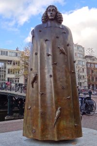 This is a photograph of a statue of Baruch Spinoza in Amsterdam.