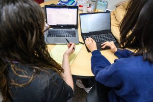 Emily Bouza (Writing Center TA at left) helps Herein Kim, a graduate student with her writing in the Writing Center in Helen C. White Hall at the University of Wisconsin–Madison on March 21, 2022.
