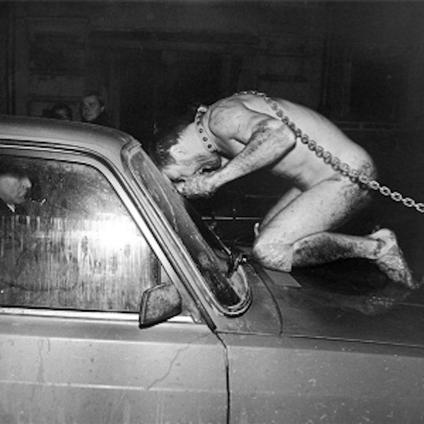 Performance artist Oleg Kulik doing Mad Dog performance.