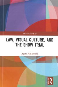 Book image of Law, Visual Culture and the Show Trial. There is a colorful abstract design behind the words. 