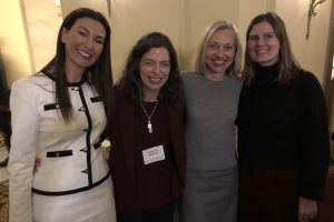 Julia Dominguez, Katie Reinhart, Kat Leck and Lizzie Neary smile at camera during RSA conference. 