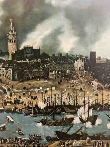 The painting is a detailed depiction of the port of Seville. In the foreground, several ships, including galleons and galleys, crowd the Guadalquivir River. The riverbank is buzzing with people. Beyond the river, the cityscape of Seville is visible, dominated by the Giralda tower and the cathedral, which rise against a cloudy sky. Various individuals go about their daily lives. 