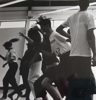 Black and white image of people dancing a piece by Louise Zamparutti.