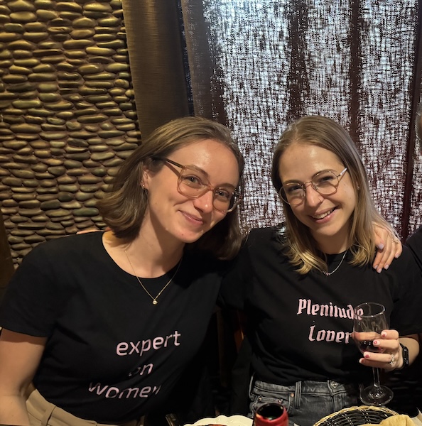 Image of Kate and Jojo Lovejoy sitting down wearing black t-shirt and smiling.